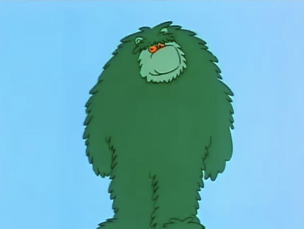 Muzzy, a big green fuzzy monster, from a 1980's educational cartoon series. 