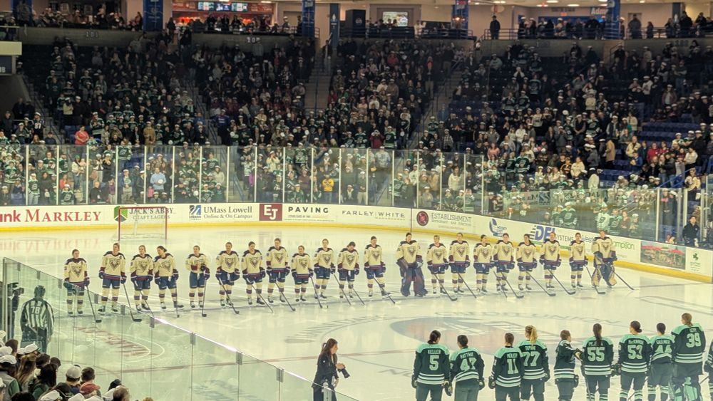 The Montreal Victoire women's ice hockey team on the blue line during the national anthems. 
