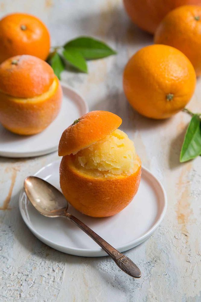 Orange sorbet served in a hollowed-out orange rind.