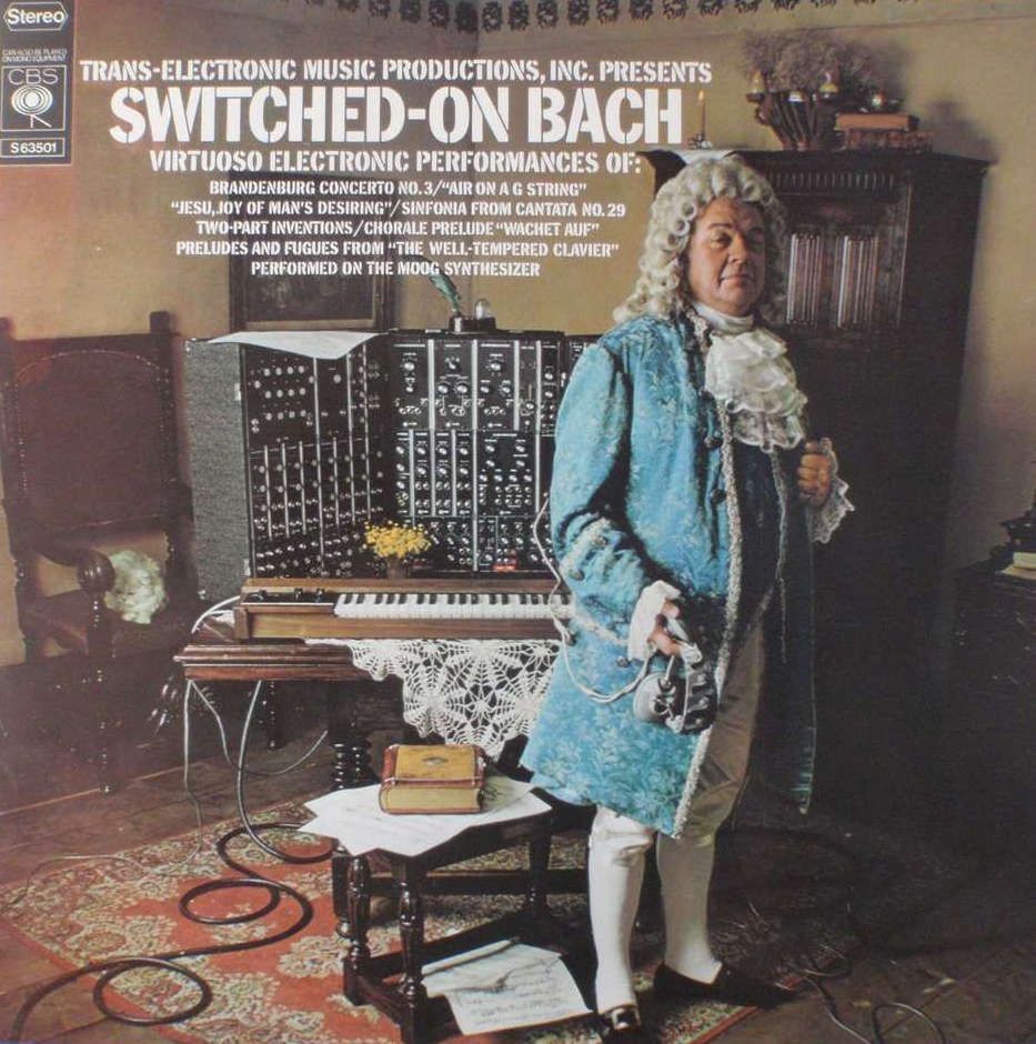 Wendy Carlos, Switched on Bach Album cover from 1968.  Trans-Electronic Music Productions, Inc.  Presents Switched-On Bach. 

Image features a gentleman regaled like Johann Sebastian Bach, standing next to a Moog Modular Synthesizer system.