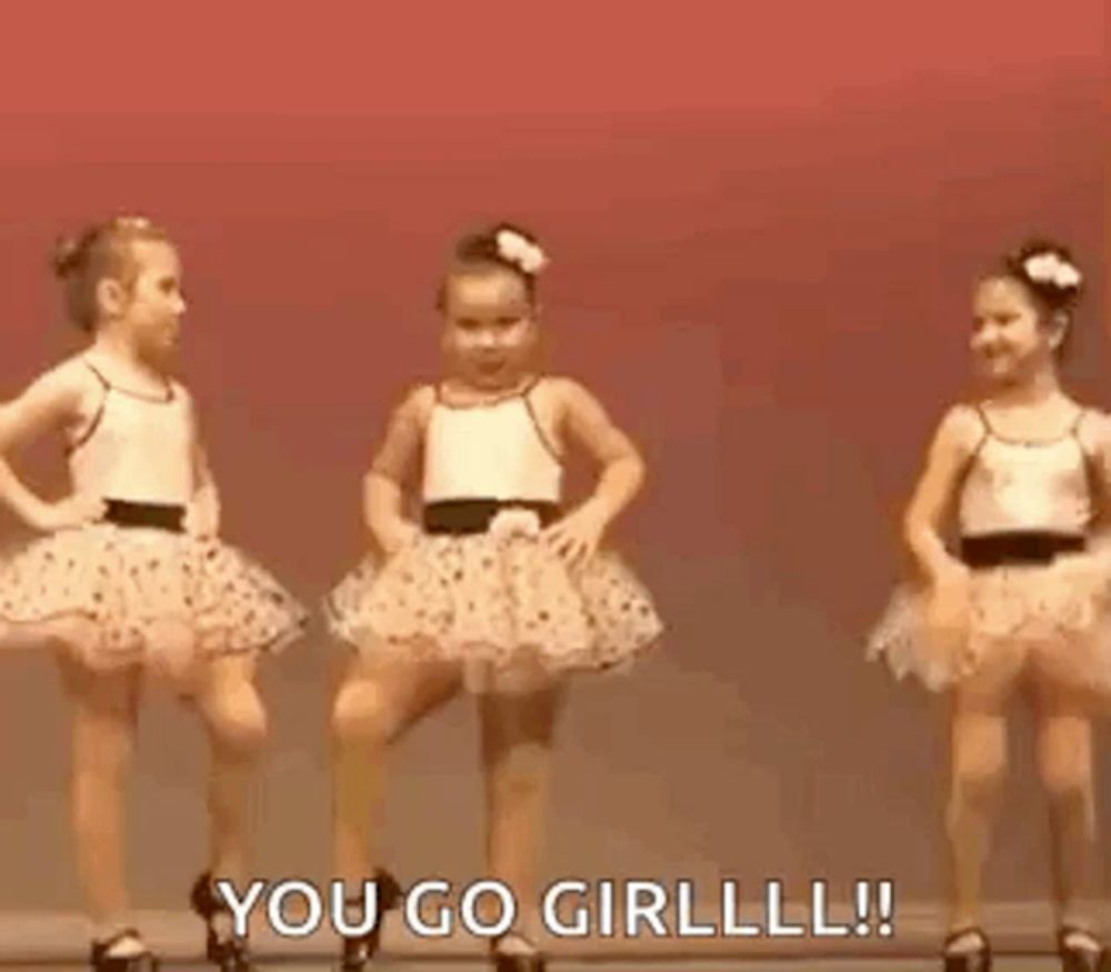 two little girls are dancing on a stage and one of them is saying `` you go girllll ! ''