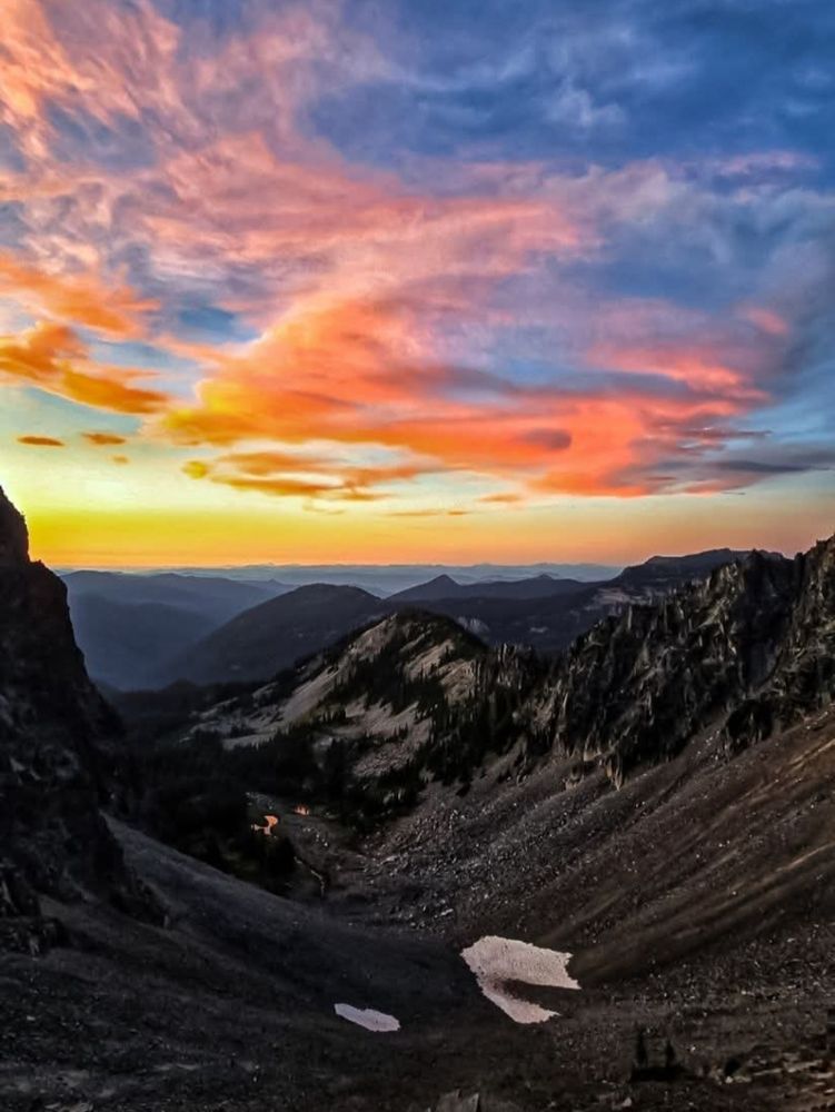 Photo of Mt. Rainier in Washington State at sunset during late July 2025, showing nearly  all snow has melted in Summer.