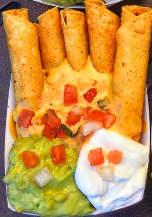 Pan fried Taquitos with melted cheese, pico de gallo, guacamole & sour cream.