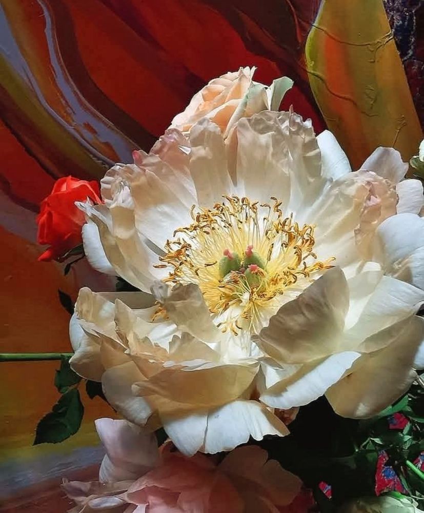 Macro photo of a white Peony flower against an abstract oil painting background.