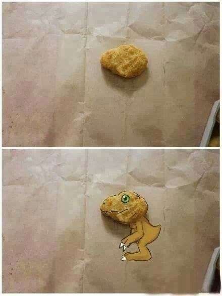 A chicken nugget that's shaped like Agumons head and the rest of Agumon is drawn in around it