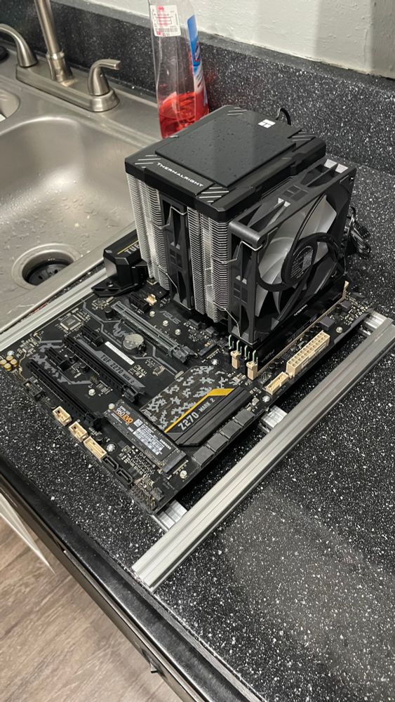 Motherboard with massive Thermaltake Assassin Pro 120 Digital Black attached to it