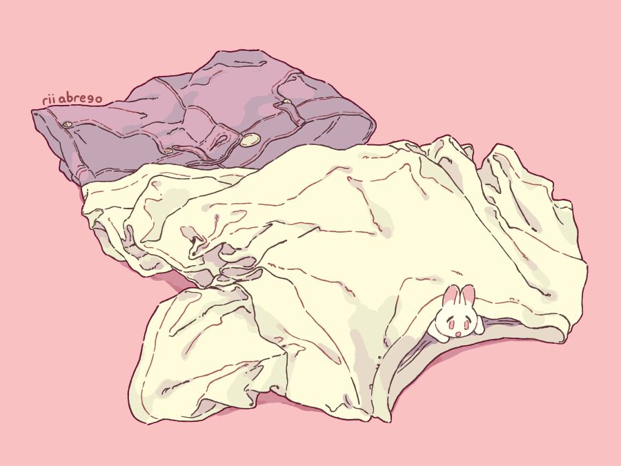 A drawing of a tiny rabbit peeking from a pile of clothing laid on the ground.