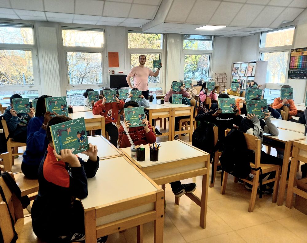 "A classroom with kids reading Ada and Zangemann"