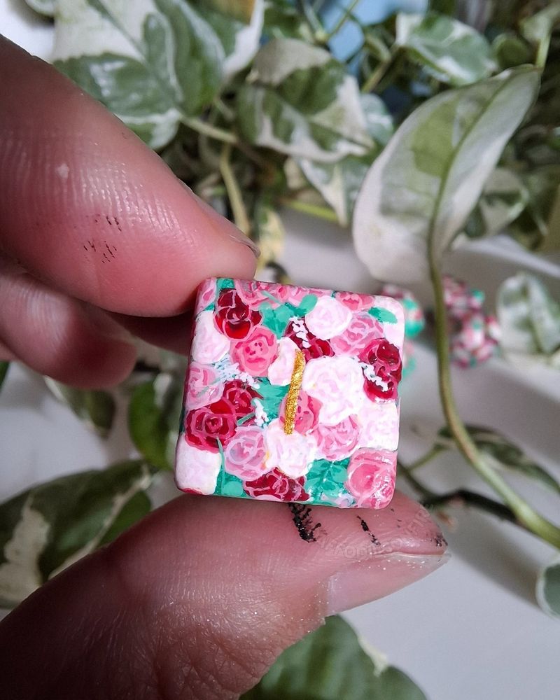A d6 adorned with hand-painted roses
