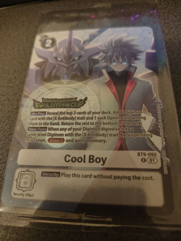 A card depicting a large white Digimon clad in armour looming behind a boy with white hair and a white coat wearing glasses. Cool Boy is the name of the card