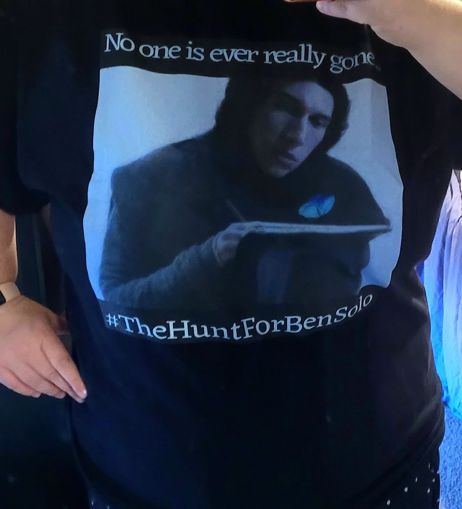 Tshirt from Redbubble with a manip I made of young Ben Solo practicing calligraphy and looking at a blue butterfly 