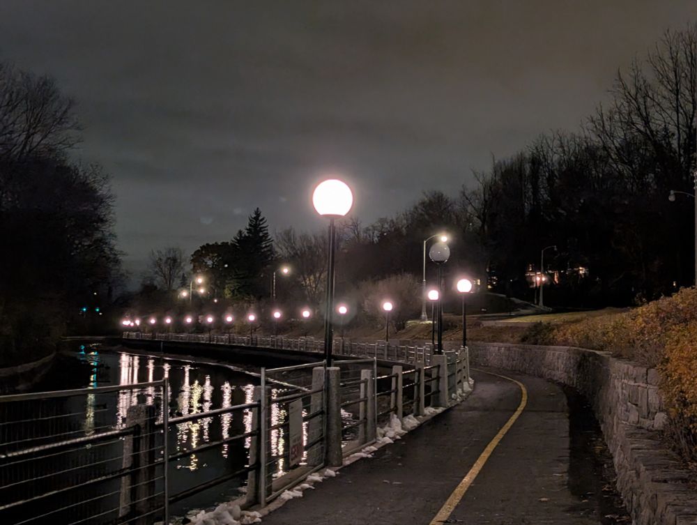 Rideau canal pathway in the dark. One light is out. 