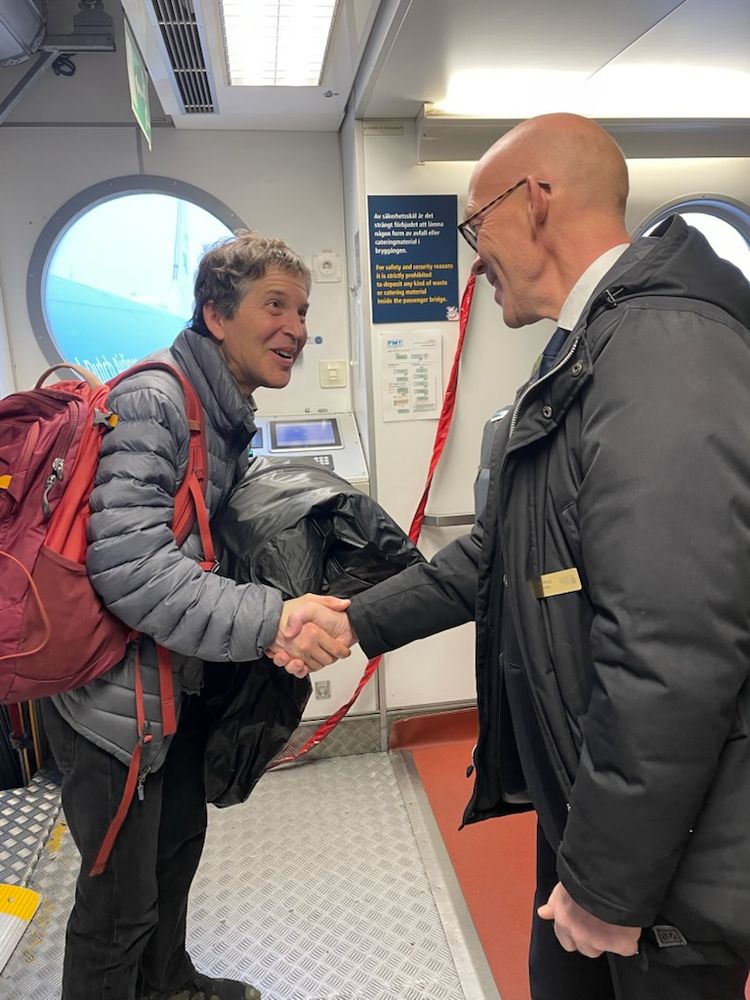 Hans Ellegren Welcoming David Baker at Stockholm Arlanda.