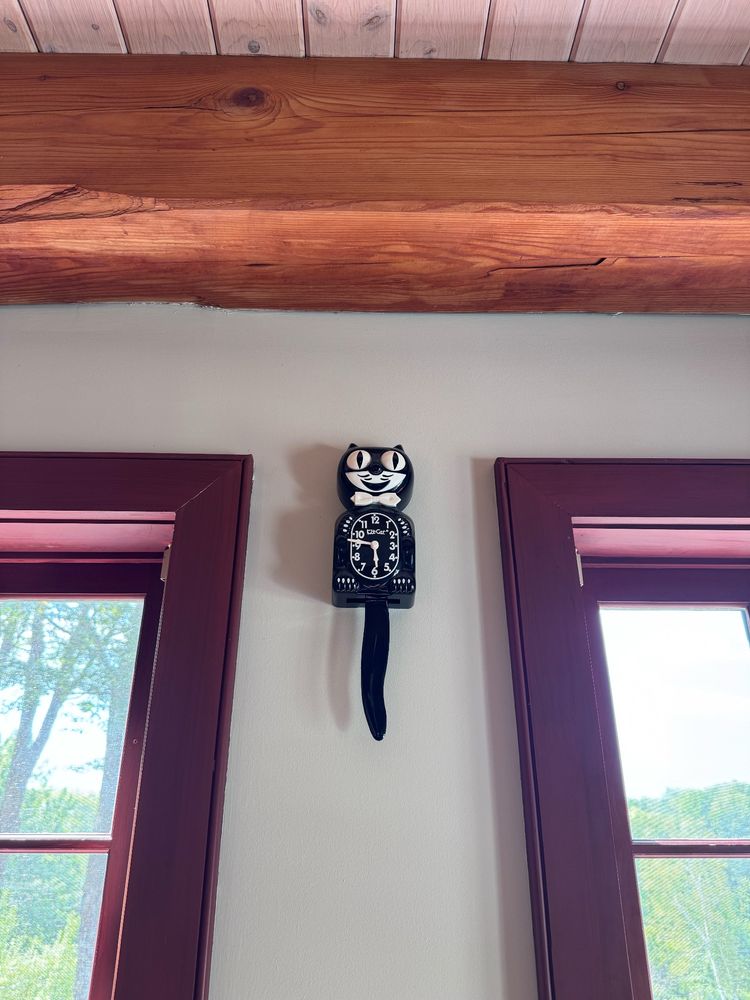 kit-cat clock on a wall 