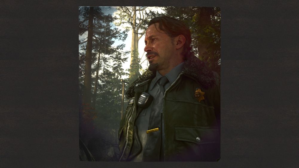 Half-body shot of Deputy Thornton from Alan Wake 2 smiling in the sunlight among the trees. 