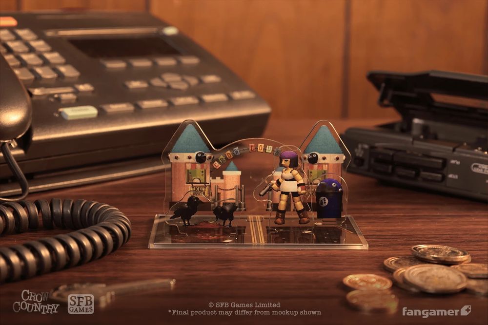 A photo of the Crow Country Deluxe Edition acrylic standee on a 90s desk set, with a conference phone and a cassette player. The standee has a set of Crow Country gates in the background, with the game's protagonist and some crows in closer layers.