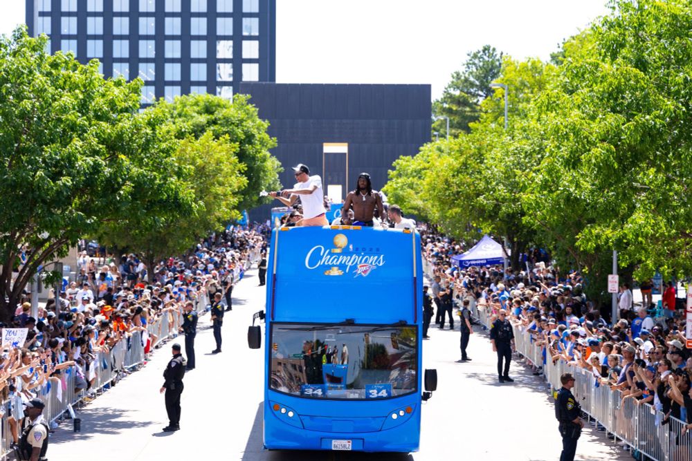 The Thunder championship parade passes by the Oklahoma City Bombing Memorial, as the city celebrates their team and themselves
