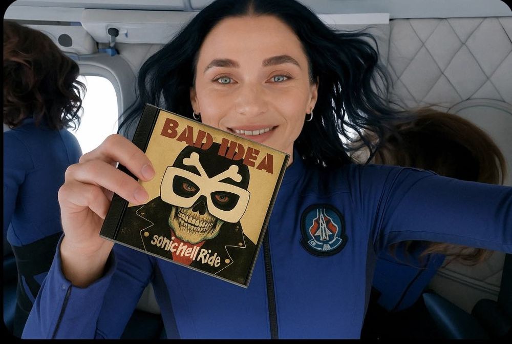 Katty Perry holding a Bad Idea CD 