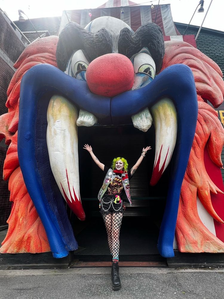 Jinx Aesthel standing within a giant scary clown head at canobie lake park