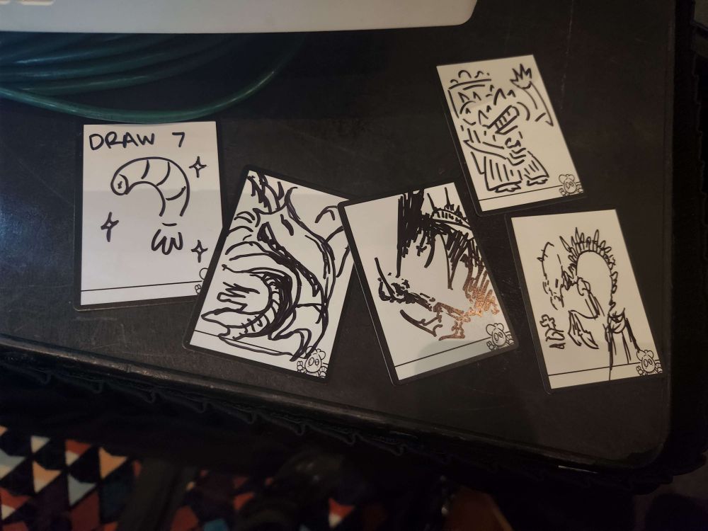 5 blank cards that have varying interpretations of Jin-Gitaxias drawn on them.