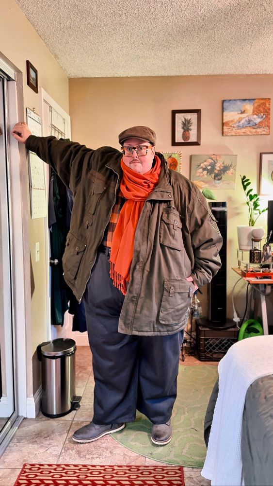 In my room leaning against my door frame. 