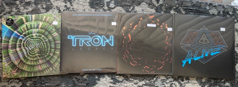 Records arrayed on the floor of my old apartment: Collapse EP (Aphex Twin), TRON Legacy Soundtrack (Daft Punk), Minecraft Volume Beta (C418), Alive 2007 (Daft Punk)