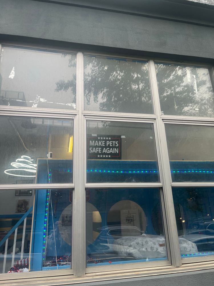 A sign saying “make pets safe again”