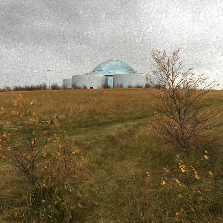 An "oil painting" style image of Perlan in Reykjavík, during autumn. The building is in the distance, while vegetation fills the foreground in fall colors.