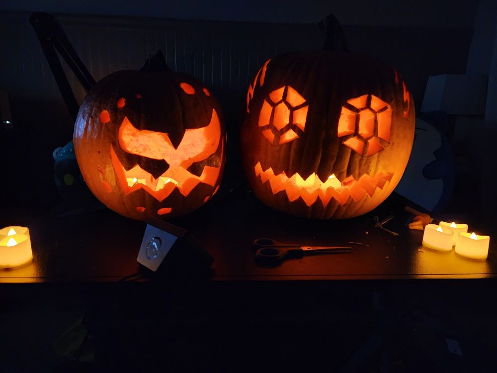 Two jack o lanterns, depicting the Pokemon Spiritomb and Sableye