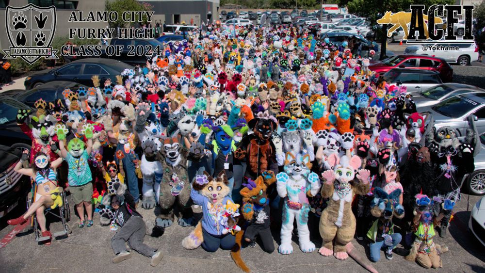Fursuit group photo for ACFI 2024.  Same as before, except this time the suiters all have their paws up in the air!