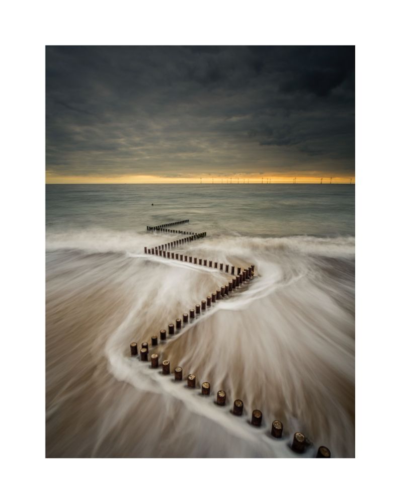 A long exposure of a zig-zag groyne on the beach at Caister-on-Sea in Norfolk. The image had long streaks of white water as a wave draws back into the sea. 

This image was awarded the Adobe Prize in the 2016 Landscape Photographer of the Year award and featured in several national newspapers and websites. 

© Damian Ward 2015. 