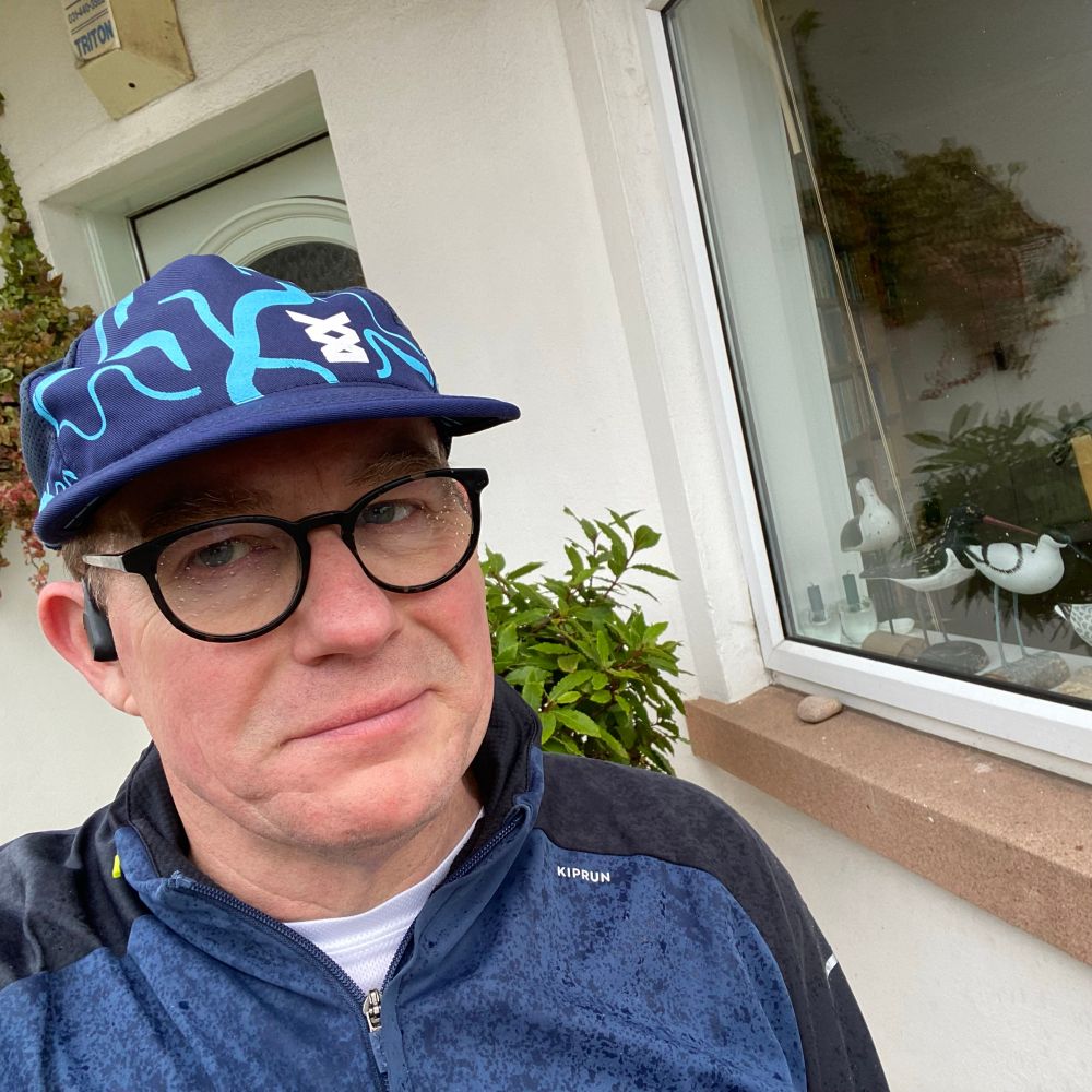 The author, a man in wet weather running gear. 