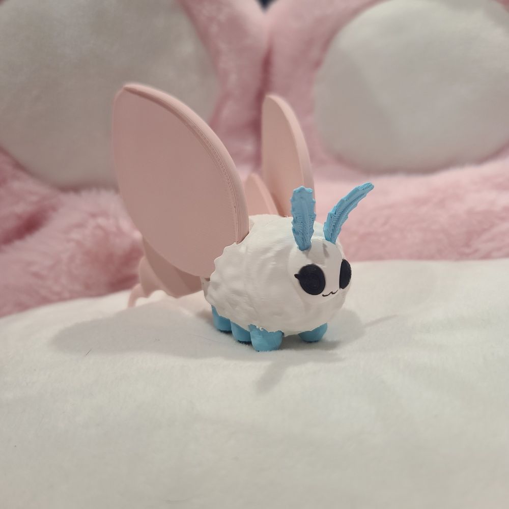A little moth figure I modeled, and 3D printed in my favorite colors. 
They go uwu.