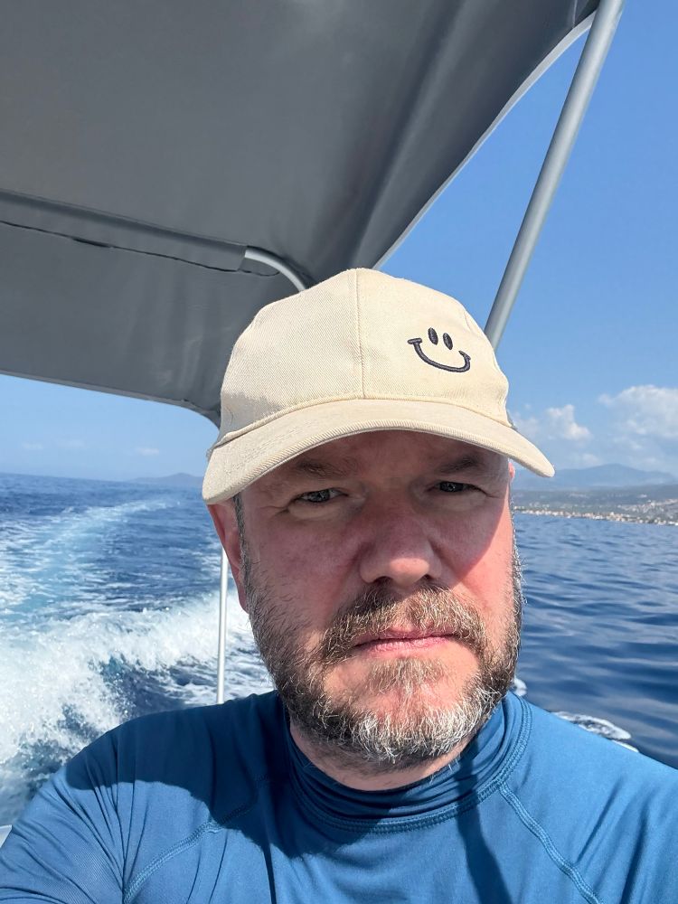 Me at the helm of a little speedboat.