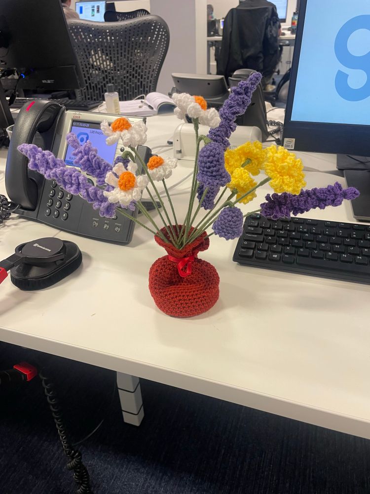 A gift from a listener of beautiful knitted flowers in a knitted vase.