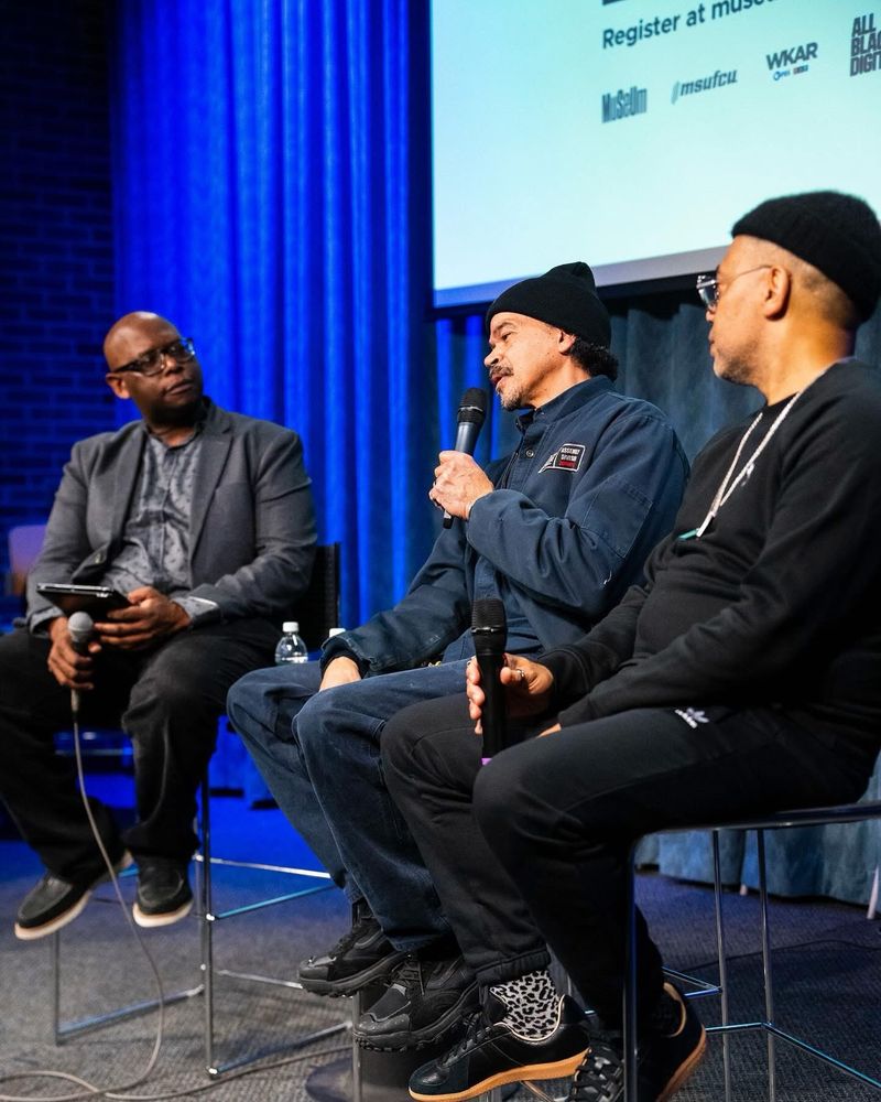 Julian Chambliss seated next to Mike Banks and Carl Craig in conversation. 
