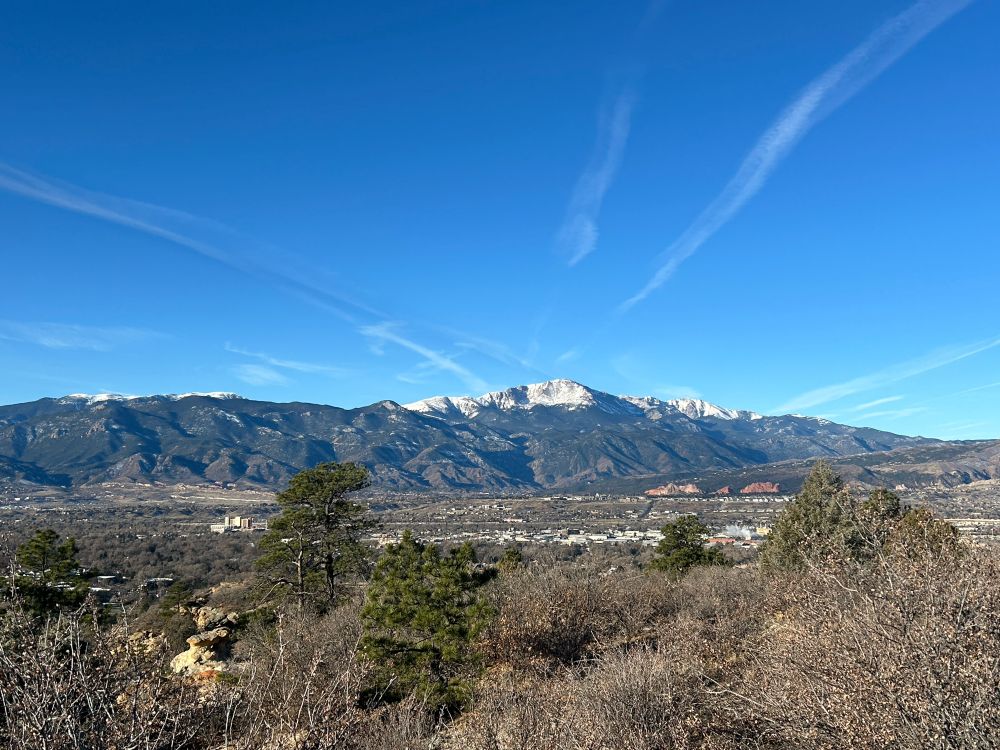 View of snow-capped mountains and rock formations in Colorado Springs