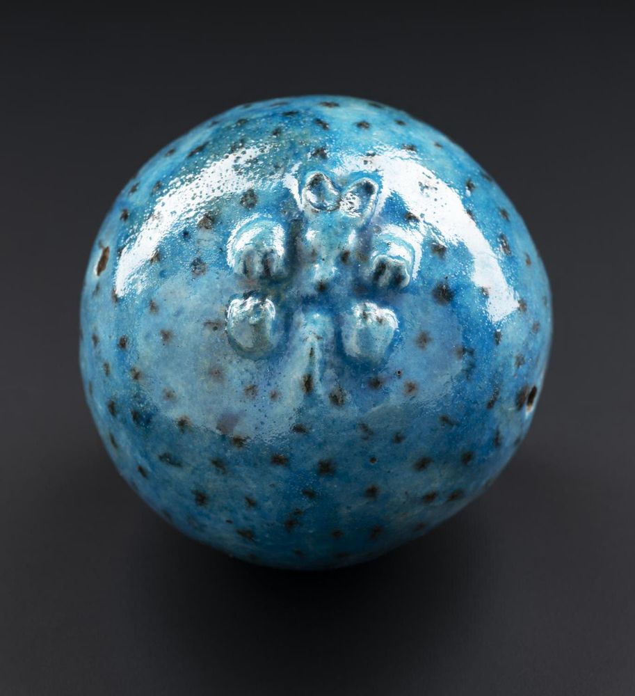 Date
Middle Kingdom, Ancient Egyptian
Collection
World Culture
Hollow blue faience spherical bead in the form of a curled-up hedgehog with moulded features and black quills: Ancient Egyptian, probably Middle Kingdom, c.1985 - 1650 BC