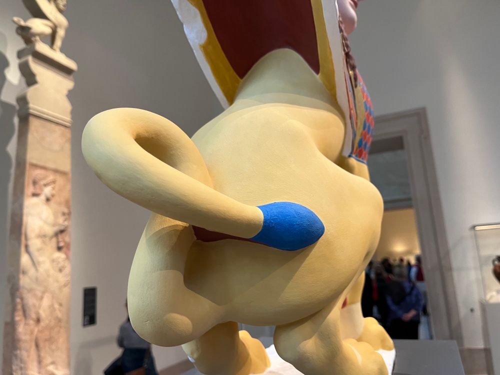 Backside of the sphinx. Photo by me. Title: Reconstruction of a marble finial in the form of a sphinx Artist: Vinzenz Brinkmann Artist: Ulrike Koch-Brinkmann Medium: Cast from polymethyl metacrylate, natural pigments in egg tempera, gold foil, and copper Dimensions: 33 7/16 × 11 × 22 7/16 in. (85 × 28 × 57 cm) Credit Line: Liebieghaus Skulpturensammlung, Polychromy Research Project, Frankfurt am Main 