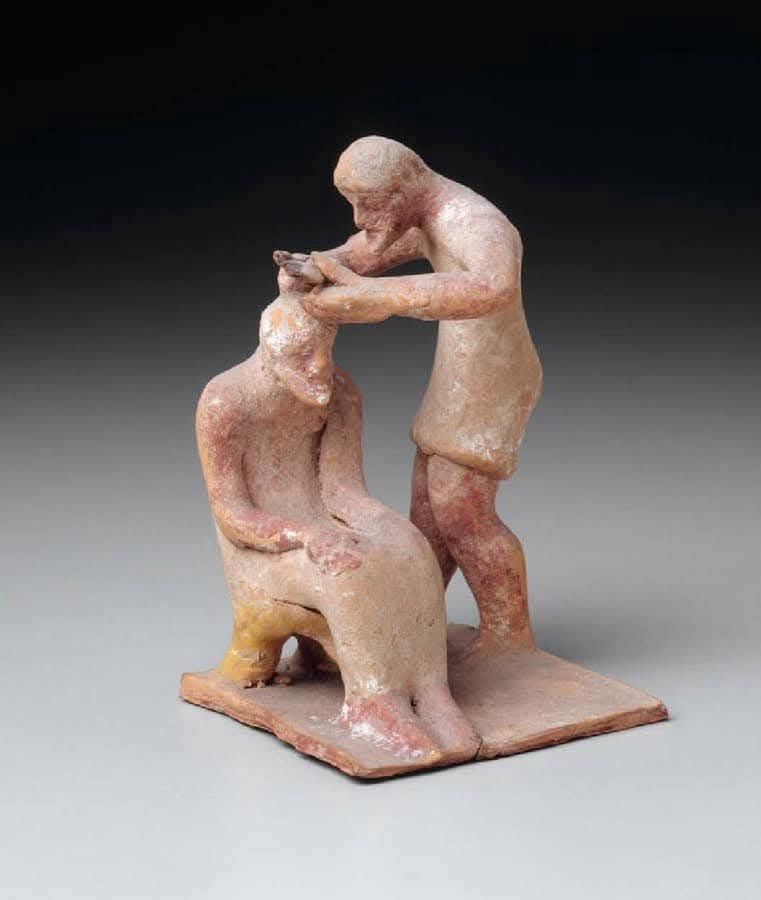 Barber cutting a man's hair
Greek Late Archaic or Early Classical Period about 500–475 BC Place of Manufacture: Greece, Boiotia, Tanagra
MEDIUM/TECHNIQUE
Terracotta
DIMENSIONS
Height: 11.6 cm (4 9/16 in.)
CREDIT LINE
Museum purchase with funds donated by contribution
ACCESSION NUMBER
01.7784
ON VIEW
Daily Life in Ancient Greece Gallery (Gallery 212A-B)
COLLECTIONS
Ancient Greece and Rome
CLASSIFICATIONS
Sculpture
DESCRIPTION
Two bearded men wearing chitons. One, a barber, cuts the hair of the seated man. The flesh of both men is dark red. The chitons appear to have been white and the stool, yellow. The base of the group was once white with red paint along the edge.
PROVENANCE
By 1901: with E. P. Warren; purchased by MFA from E. P. Warren, December 1901