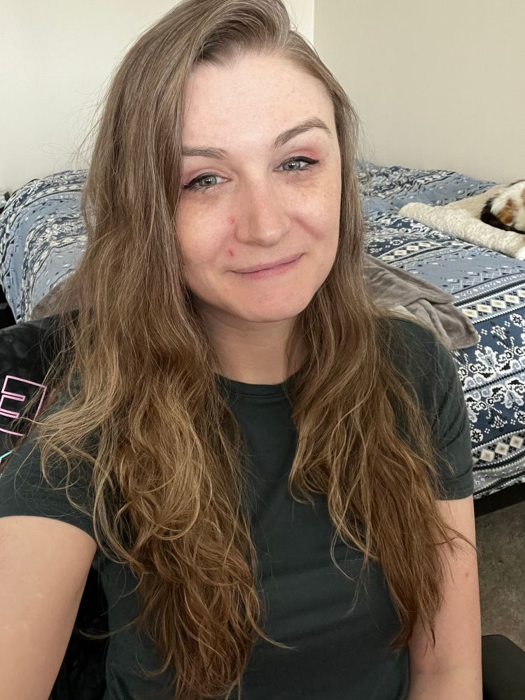 Selfie of Crev wearing a dark green shirt. 
