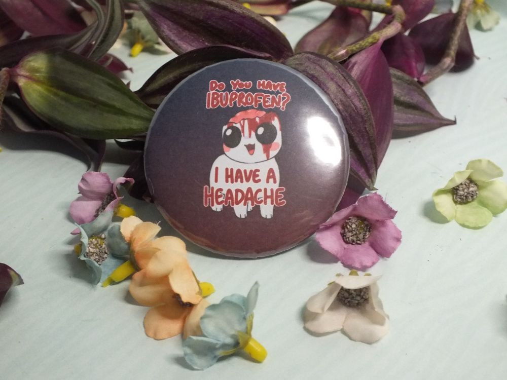 A stock photo of a badge featuring an autism creature with a rather serious headache.