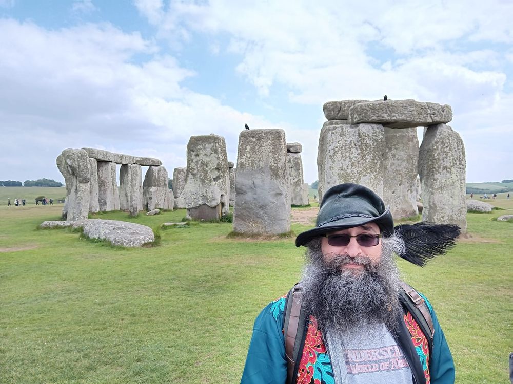 Stonehenge, same gent standing before the stones.