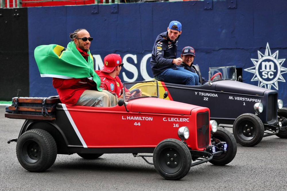 Charles Leclerc and Max Verstappen talking to each other during the driver's parade in Sao Paulo.