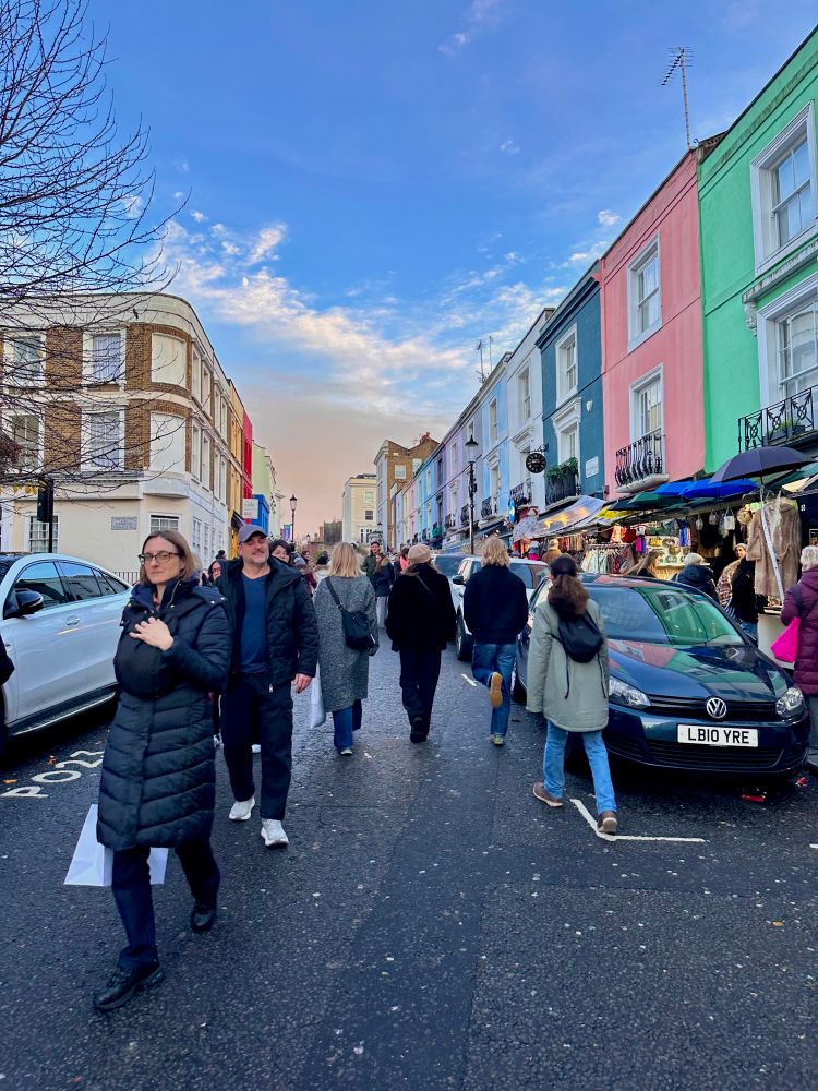 A photo of people walking on Portobello Road in London.