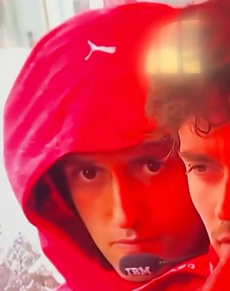 Bryan Bozzi with his hood over his head and looking annoyed.