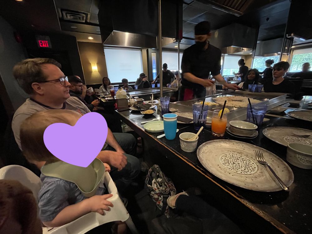 Blair and Miles sit in awe at teppanyaki. 