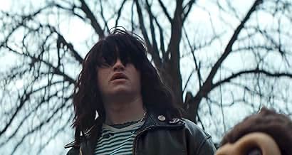 rohan campbell with a ramones wig and a striped shirt