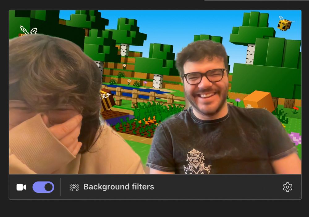Screen cap of myself and Ray with a Minecraft Background on teams. 