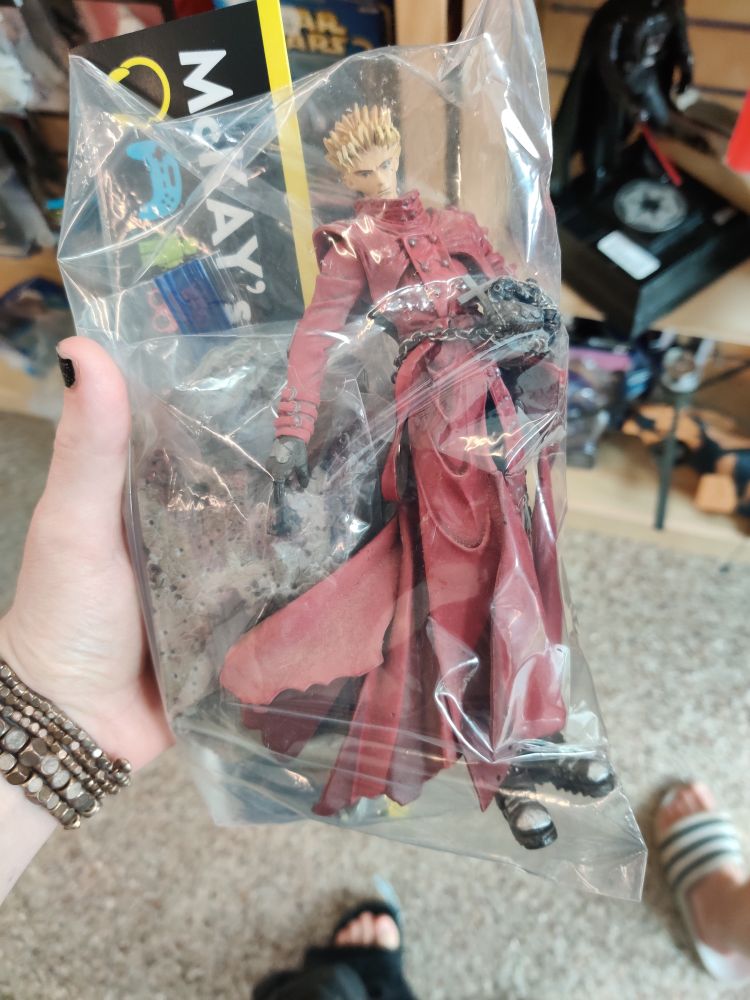 A bagged figure of Vash the stampede from the original Trigun anime.